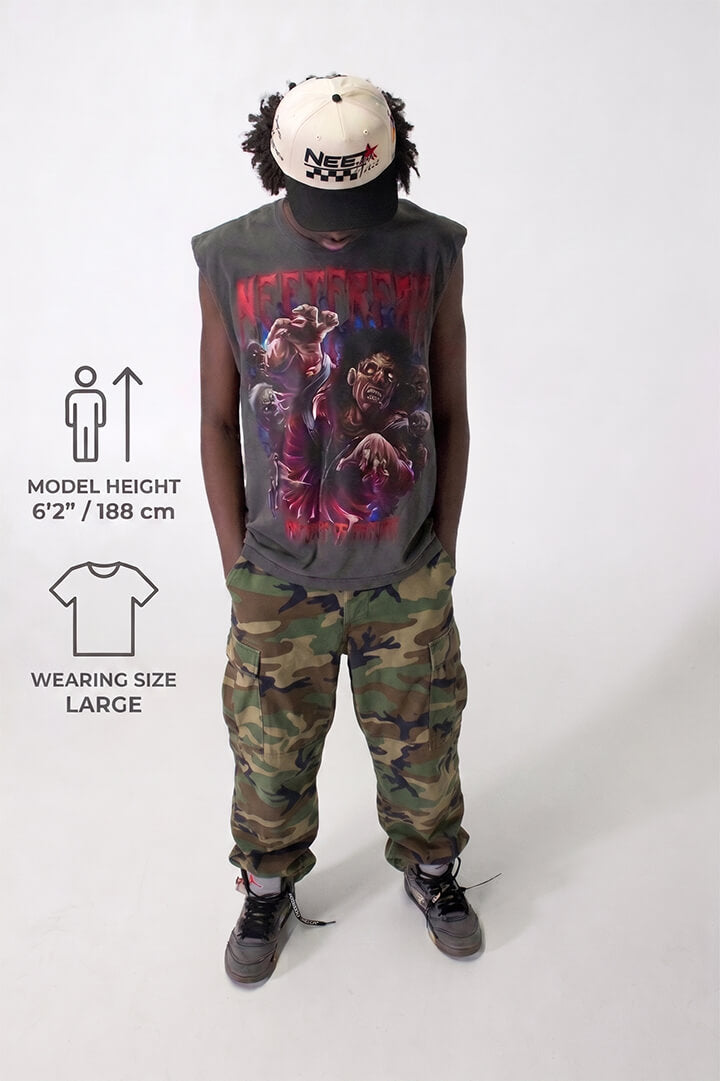 Person wearing a graphic t-shirt and camouflage pants on a white background