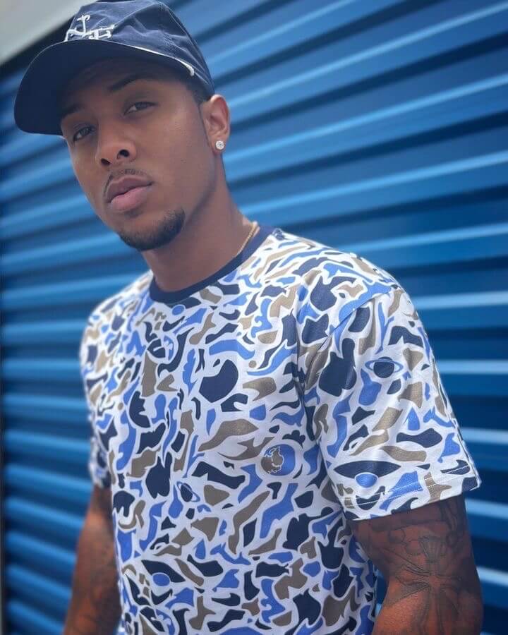 Male model wearing Short-sleeve T-shirt in a classic woodland camouflage pattern, made from 100% premium cotton, showing a true-to-size fit.