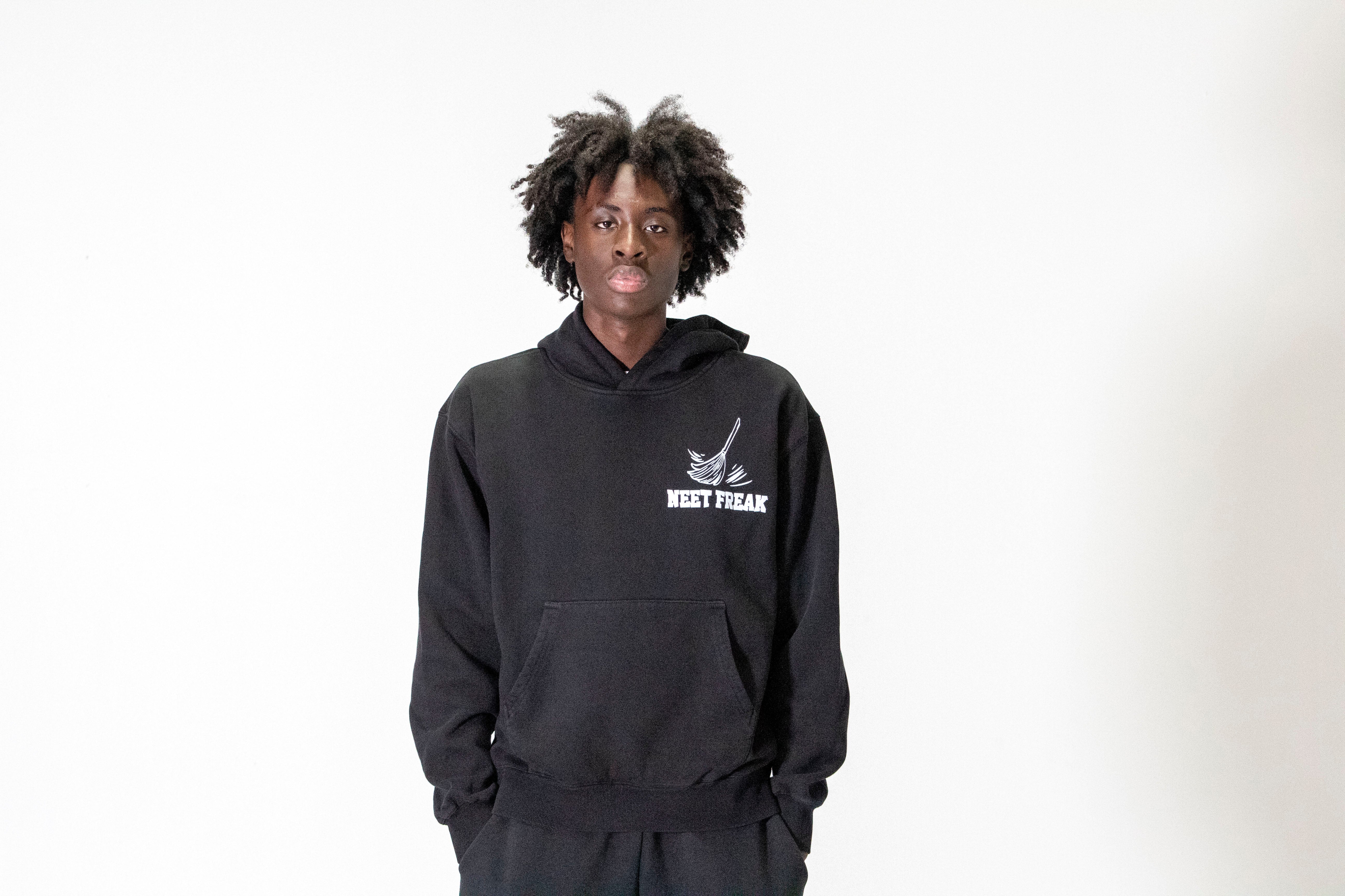 Model with Black Boxy Cut Hoodie. The Brush Off Hoodie.
