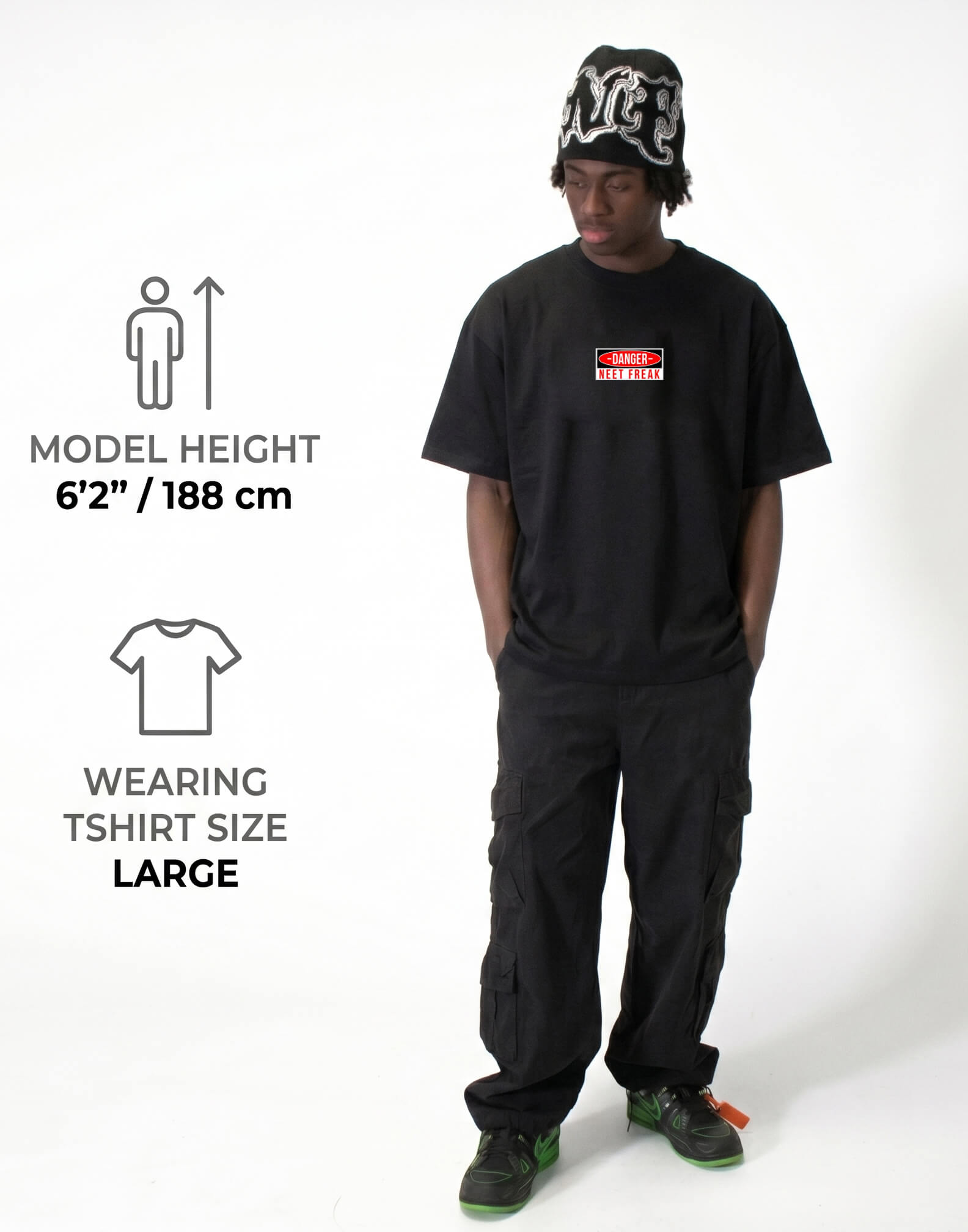 Person wearing a black t-shirt and cargo pants with model height and clothing size information displayed.