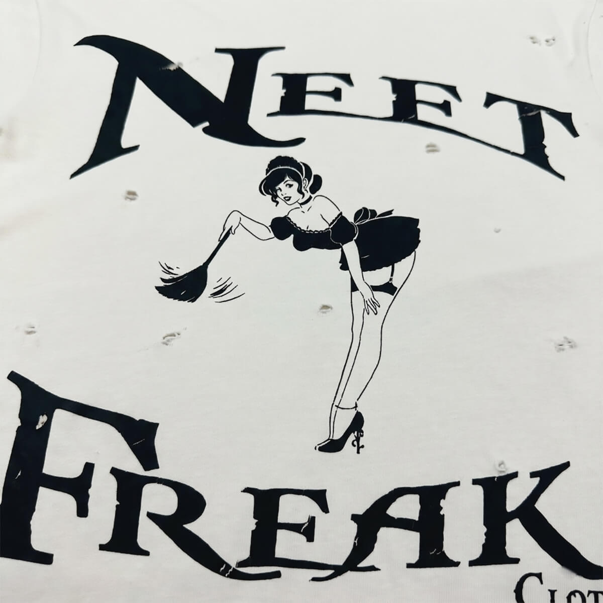 Vintage-style logo with a woman holding a broom and the text 'Neet Freak' on a white background.