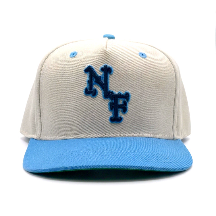 Natural and Baby Blue Strap Back Hat with NF embroidered on the front. Inside lined with satin to better Hair Care.