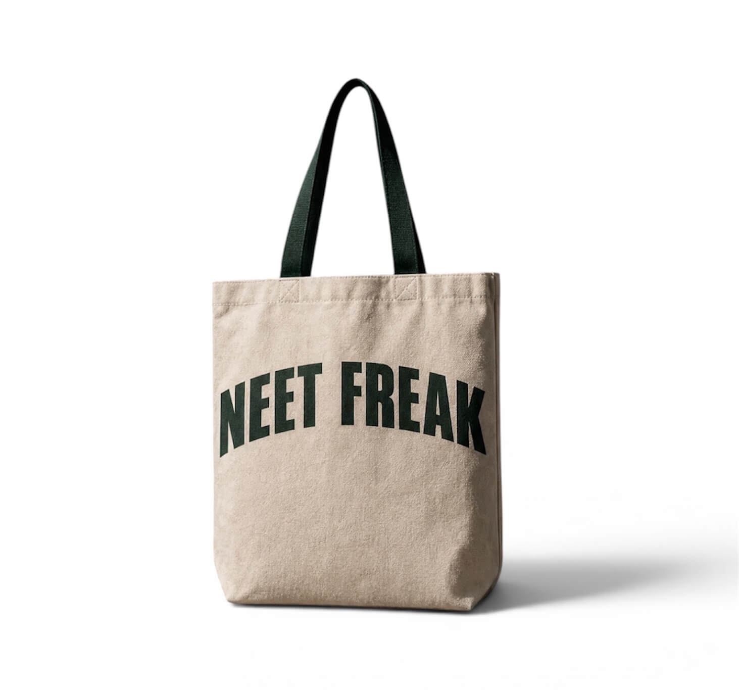 Beige tote bag with 'NEET FREAK' text on a white background
