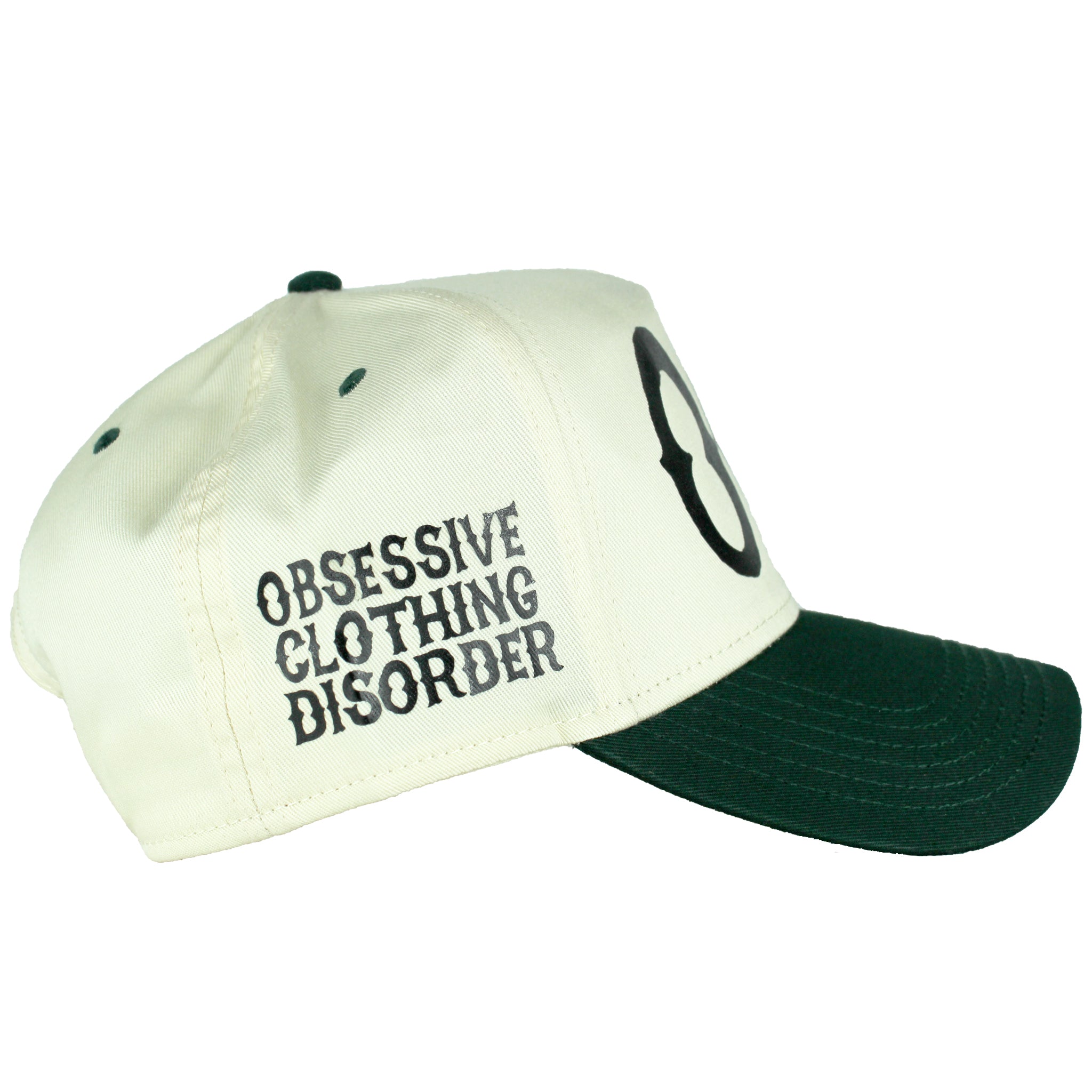 Right side of Premium dark green and natural trucker hat with black printed 'OCD' acronym, symbolizing Obsessive Clothing Disorder.